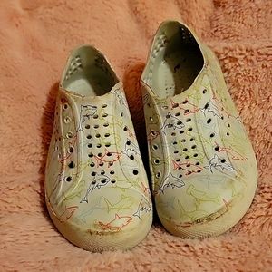 Off brand, shark water shoes.